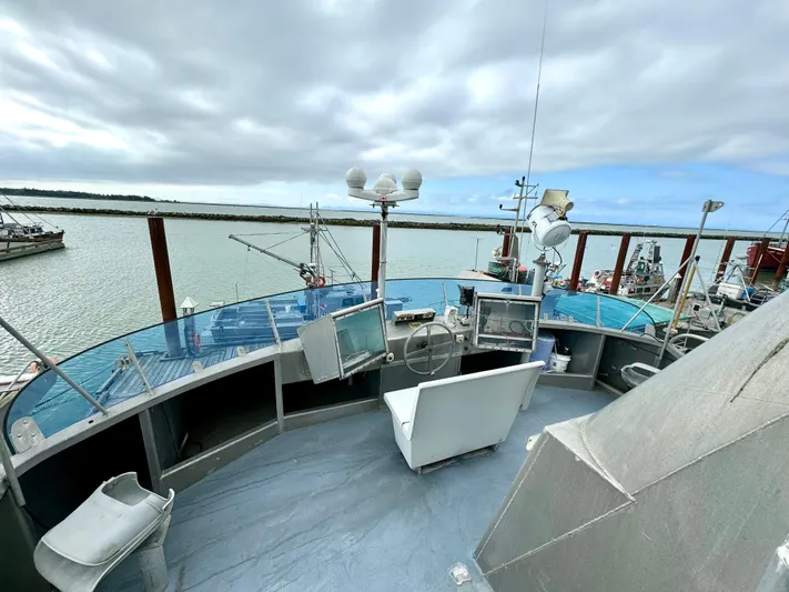 Western Shore Yacht Photos Pics 1989 Custom Expedition Yacht helm with panoramic water views and navigational equipment.