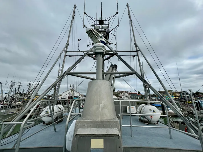 Western Shore Yacht Photos Pics 1989 Custom Expedition Yacht with complex rigging and equipment, docked in a busy marina.