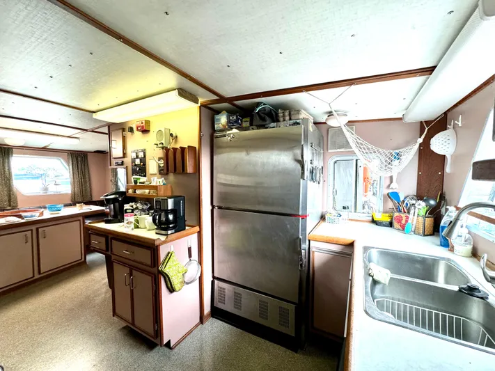 Western Shore Yacht Photos Pics 1989 Custom Expedition Yacht kitchen with stainless steel appliances and ample counter space.