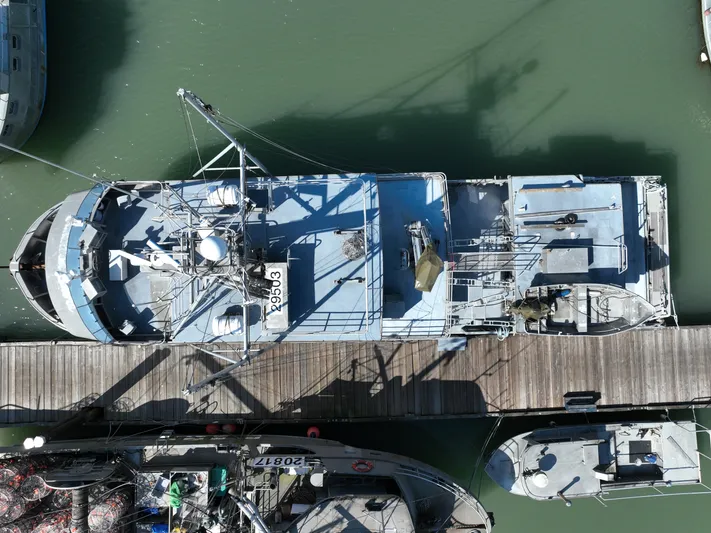 Western Shore Yacht Photos Pics Aerial view of a 1989 Custom Expedition Yacht docked at a marina.