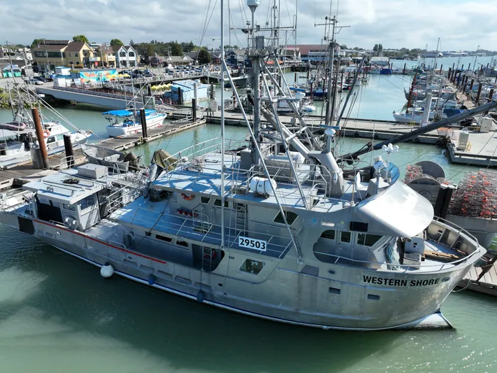 Western Shore Yacht Photos Pics Custom 1989 Expedition Yacht docked in a marina, named "Western Shore."