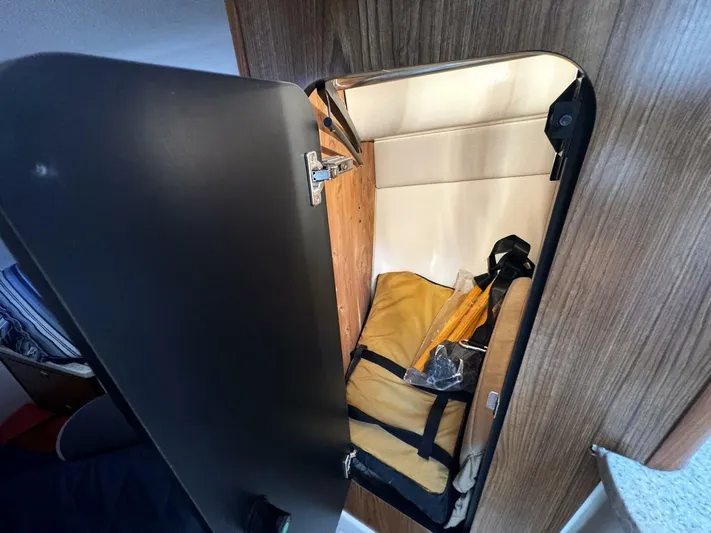 Liberty Yacht Photos Pics Storage compartment inside a 2010 Pursuit OS 345 Offshore boat.