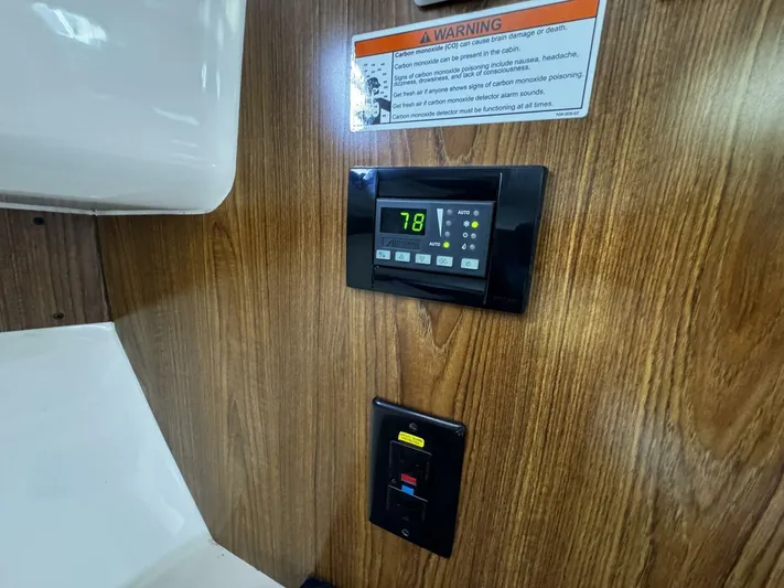 Liberty Yacht Photos Pics Control panel and warning label inside a 2010 Pursuit OS 345 Offshore boat.