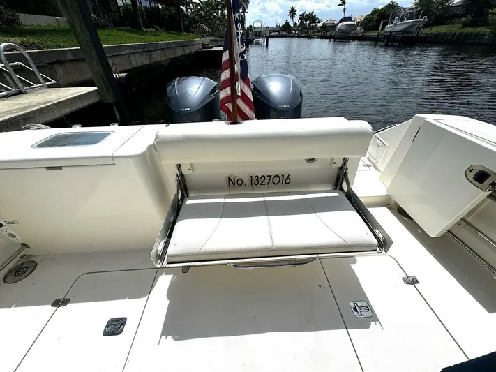 Liberty Yacht Photos Pics 2010 Pursuit OS 345 Offshore boat with twin engines and seating area.