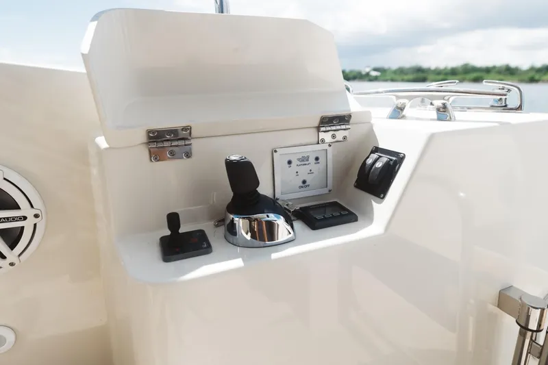  Yacht Photos Pics Control panel of 2015 Beneteau Monte Carlo 5 yacht, featuring joystick and navigation controls.