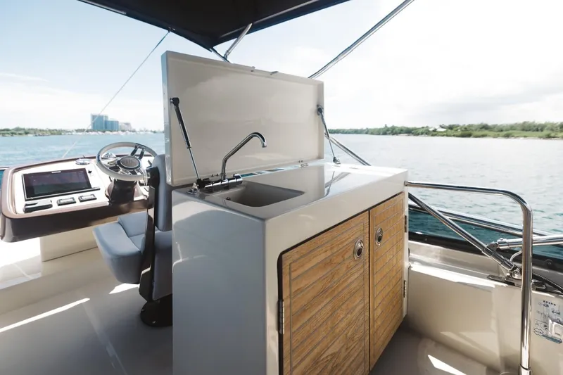  Yacht Photos Pics Beneteau Monte Carlo 5 yacht kitchen area with sink, 2015 model, overlooking water.