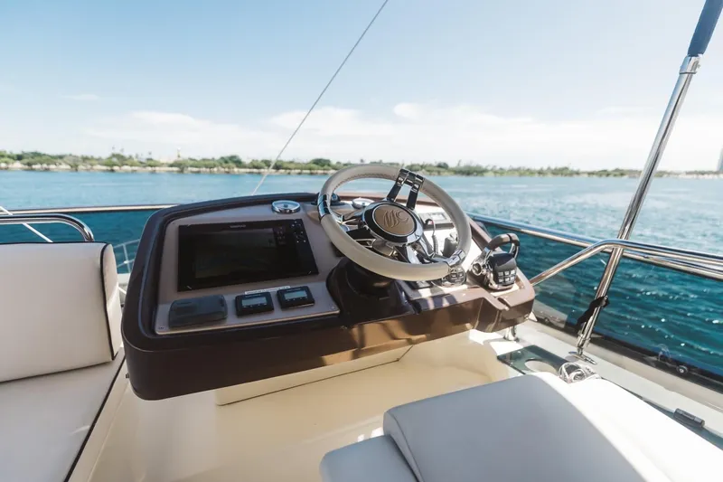  Yacht Photos Pics Steering console of 2015 Beneteau Monte Carlo 5 yacht with ocean view.