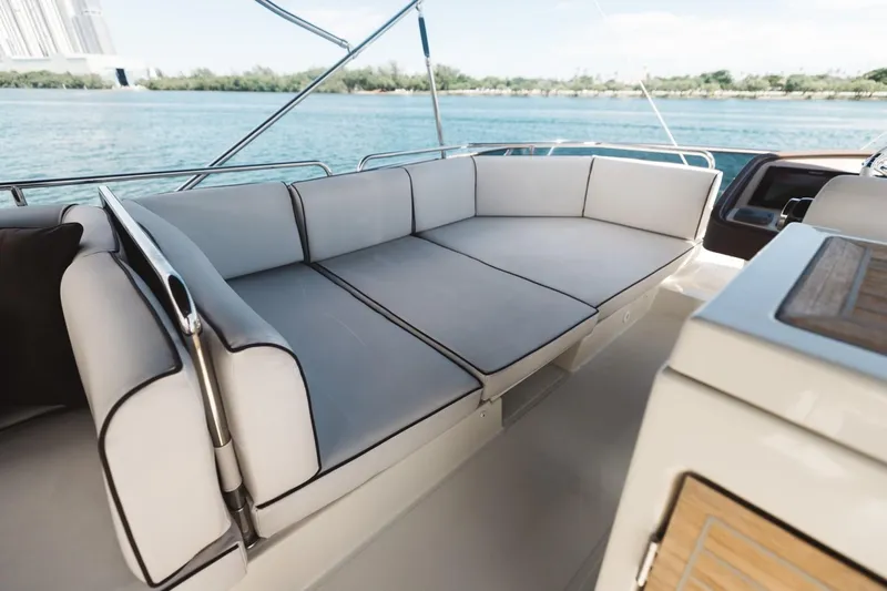  Yacht Photos Pics Luxurious seating on 2015 Beneteau Monte Carlo 5 yacht, overlooking serene waters.