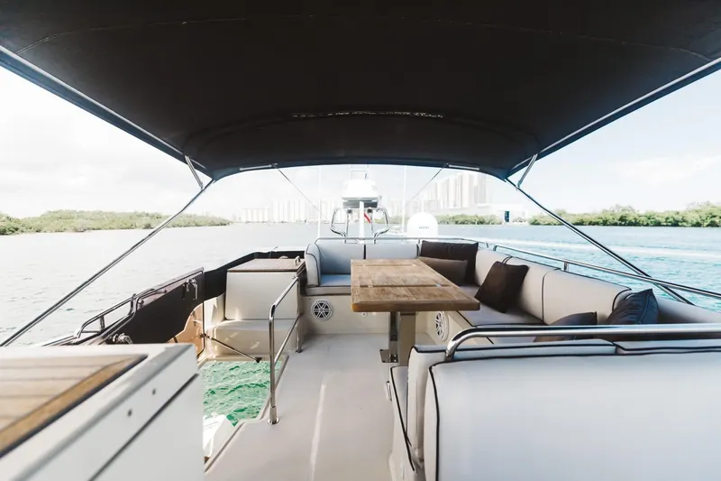  Yacht Photos Pics 2015 Beneteau Monte Carlo 5 yacht interior with seating and table on deck.