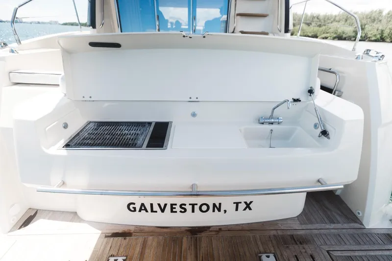  Yacht Photos Pics Beneteau Monte Carlo 5 yacht stern with grill and sink, Galveston, TX, 2015 model.
