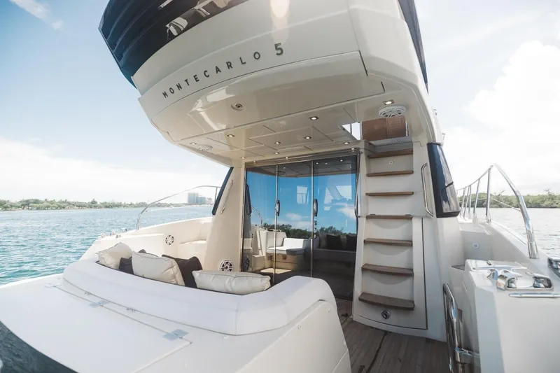  Yacht Photos Pics 2015 Beneteau Monte Carlo 5 yacht with luxurious deck and seating area.