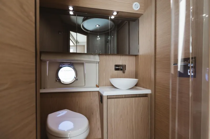  Yacht Photos Pics Luxurious bathroom in 2015 Beneteau Monte Carlo 5 yacht with modern fixtures.