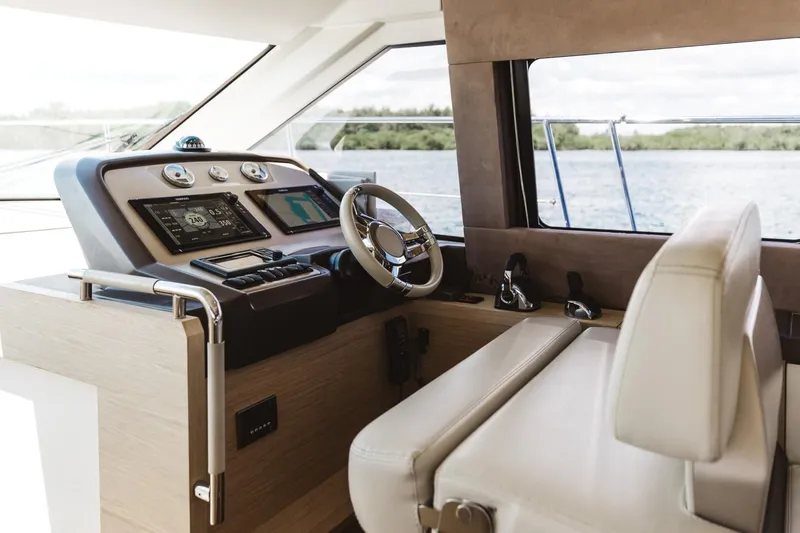  Yacht Photos Pics 2015 Beneteau Monte Carlo 5 yacht helm with modern controls and scenic water view.