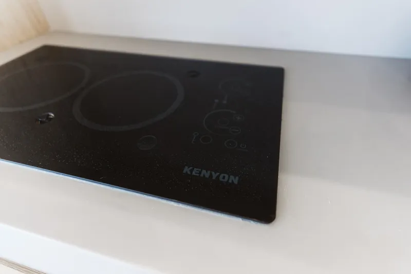  Yacht Photos Pics Kenyon cooktop on 2015 Beneteau Monte Carlo 5 yacht kitchen counter.