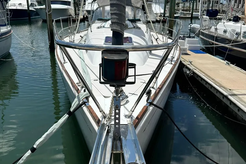 Champagne Lady Yacht Photos Pics Sailboat docked in marina, Sabre 386, 2007 model, with visible bow and rigging.