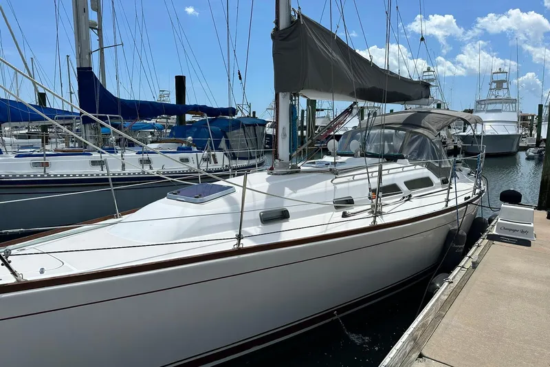 Champagne Lady Yacht Photos Pics 2007 Sabre 386 sailboat docked at marina under clear blue sky.