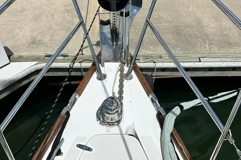 Champagne Lady Yacht Photos Pics Bow of 2007 Sabre 386 sailboat with anchor chain and railing at dock.