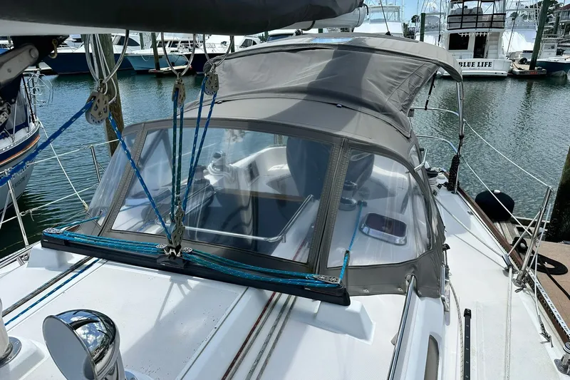 Champagne Lady Yacht Photos Pics 2007 Sabre 386 sailboat docked, featuring a covered cockpit and rigging details.