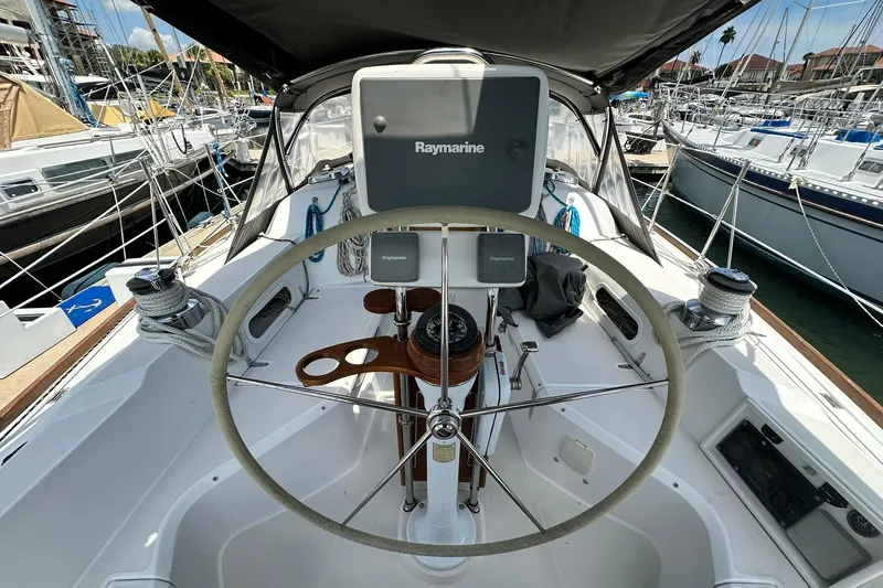 Champagne Lady Yacht Photos Pics Cockpit of 2007 Sabre 386 sailboat with steering wheel and navigation equipment.