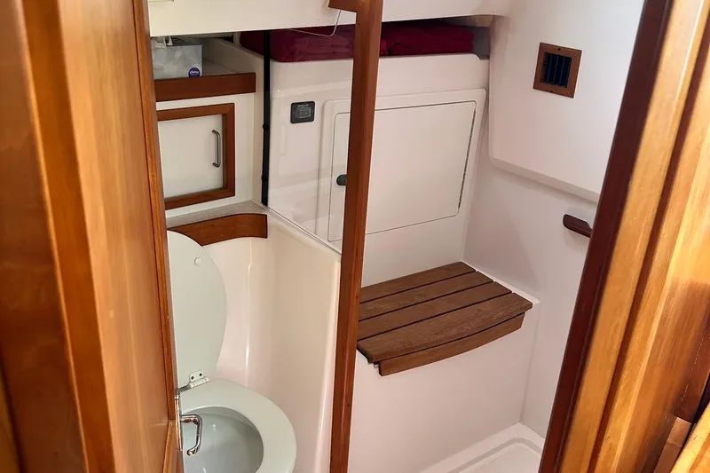 Champagne Lady Yacht Photos Pics 2007 Sabre 386 yacht bathroom with wooden accents and compact design.