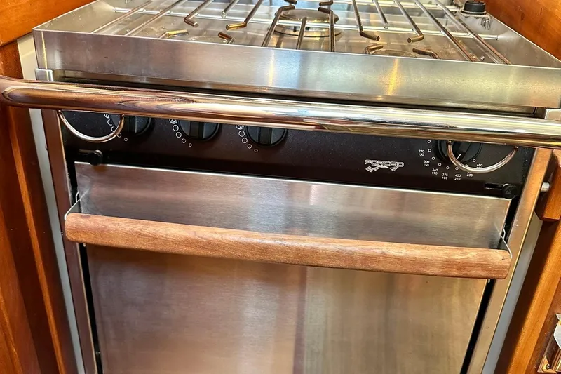 Champagne Lady Yacht Photos Pics Stainless steel oven with wooden handle in a 2007 Sabre 386 yacht kitchen.