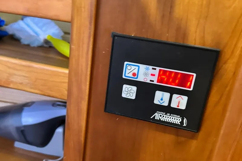 Champagne Lady Yacht Photos Pics Control panel of a 2007 Sabre 386 yacht with digital display and buttons.