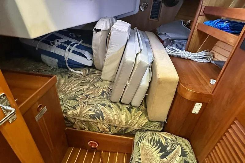 Champagne Lady Yacht Photos Pics Interior of 2007 Sabre 386 sailboat with cushions and storage area.