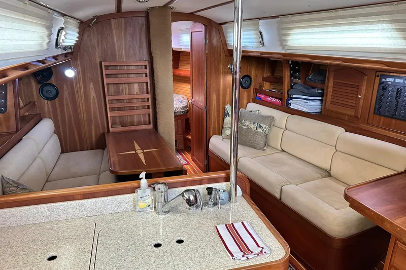Champagne Lady Yacht Photos Pics Luxurious 2007 Sabre 386 yacht interior with cozy seating and elegant wood finishes.