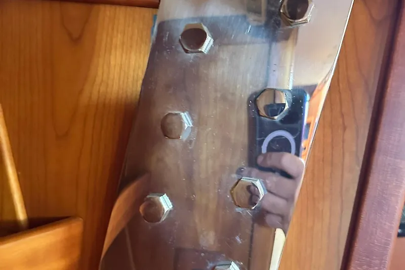 Champagne Lady Yacht Photos Pics Close-up of a reflective metal surface with bolts, Sabre 386, 2007 model.