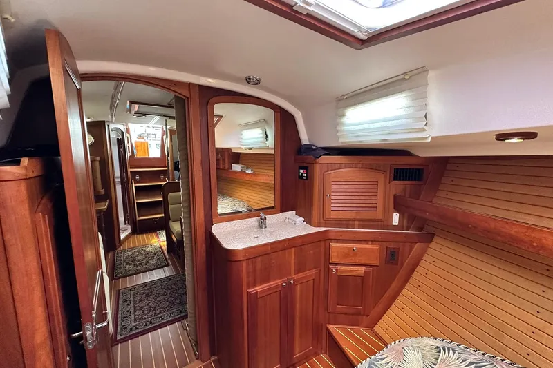 Champagne Lady Yacht Photos Pics Interior of 2007 Sabre 386 yacht with wooden cabinetry and cozy design.