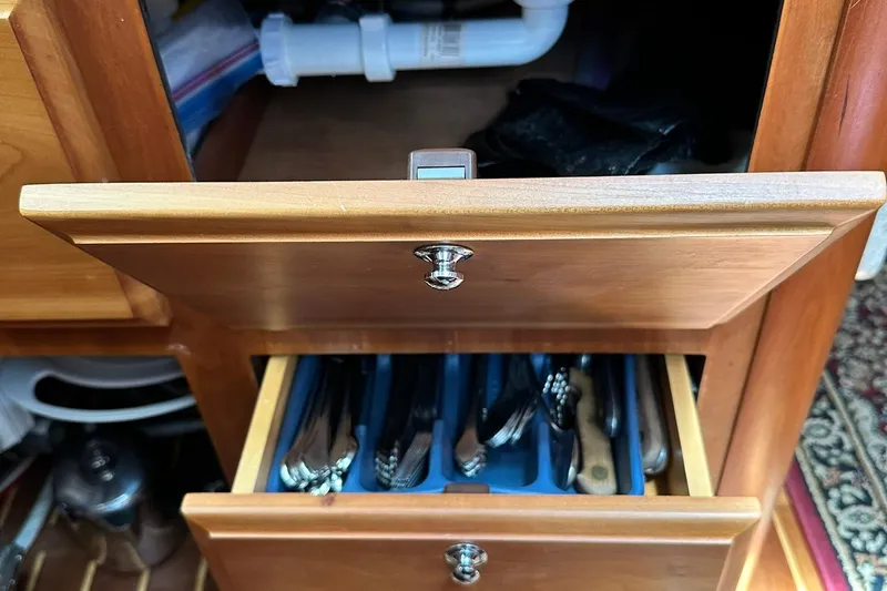 Champagne Lady Yacht Photos Pics Wooden kitchen drawers with utensils, open in a Sabre 386, 2007 model.
