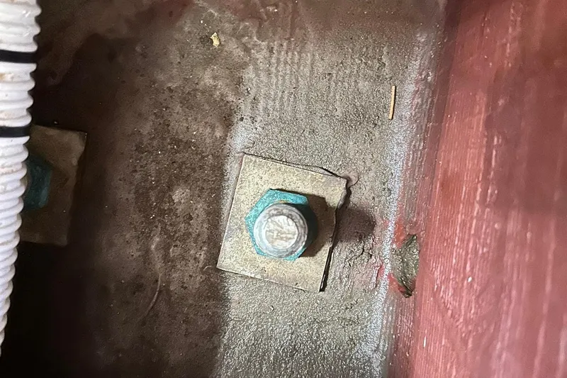 Champagne Lady Yacht Photos Pics Close-up of a bolt on a Sabre 386, 2007 model, with visible corrosion.