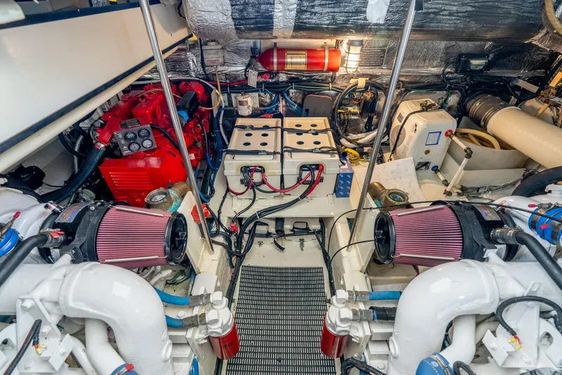 Magic Yacht Photos Pics Engine room of 1992 Tiara Yachts 4300 Open, featuring dual engines and battery setup.
