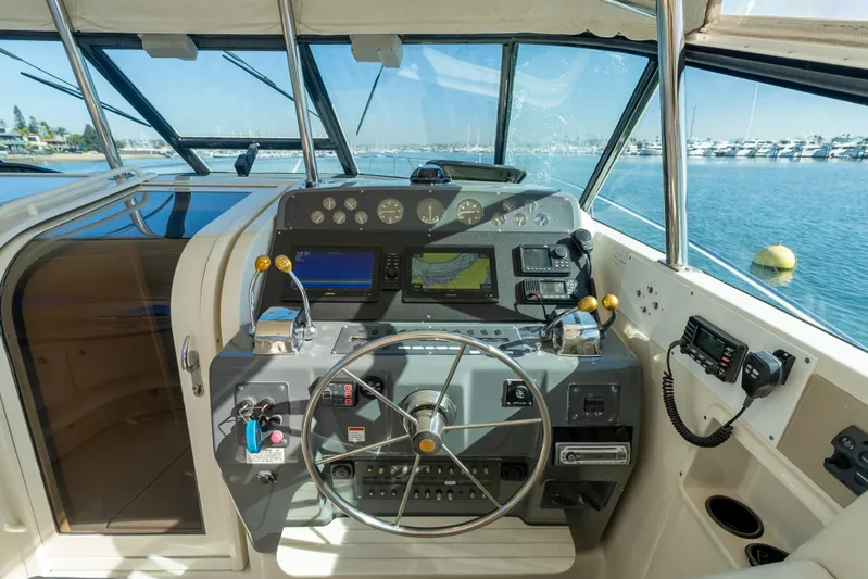 Magic Yacht Photos Pics 1992 Tiara Yachts 4300 Open helm with navigation instruments and ocean view.