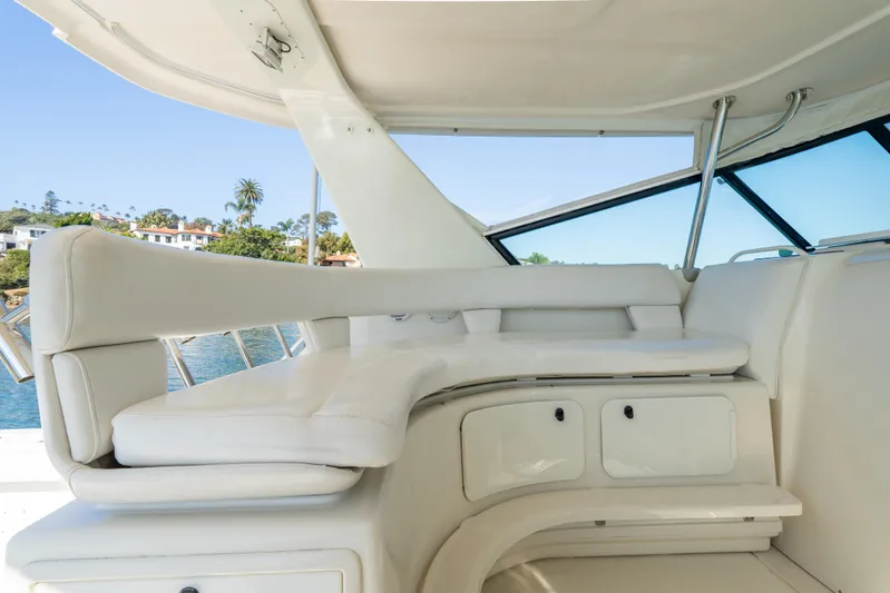 Magic Yacht Photos Pics Luxurious seating area on a 1992 Tiara Yachts 4300 Open, featuring elegant white upholstery.