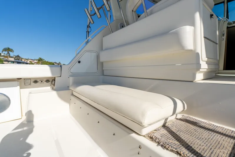Magic Yacht Photos Pics 1992 Tiara Yachts 4300 Open interior with white seating and sunny deck view.