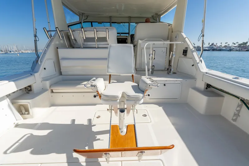Magic Yacht Photos Pics 1992 Tiara Yachts 4300 Open cockpit with fishing chair, ocean view.