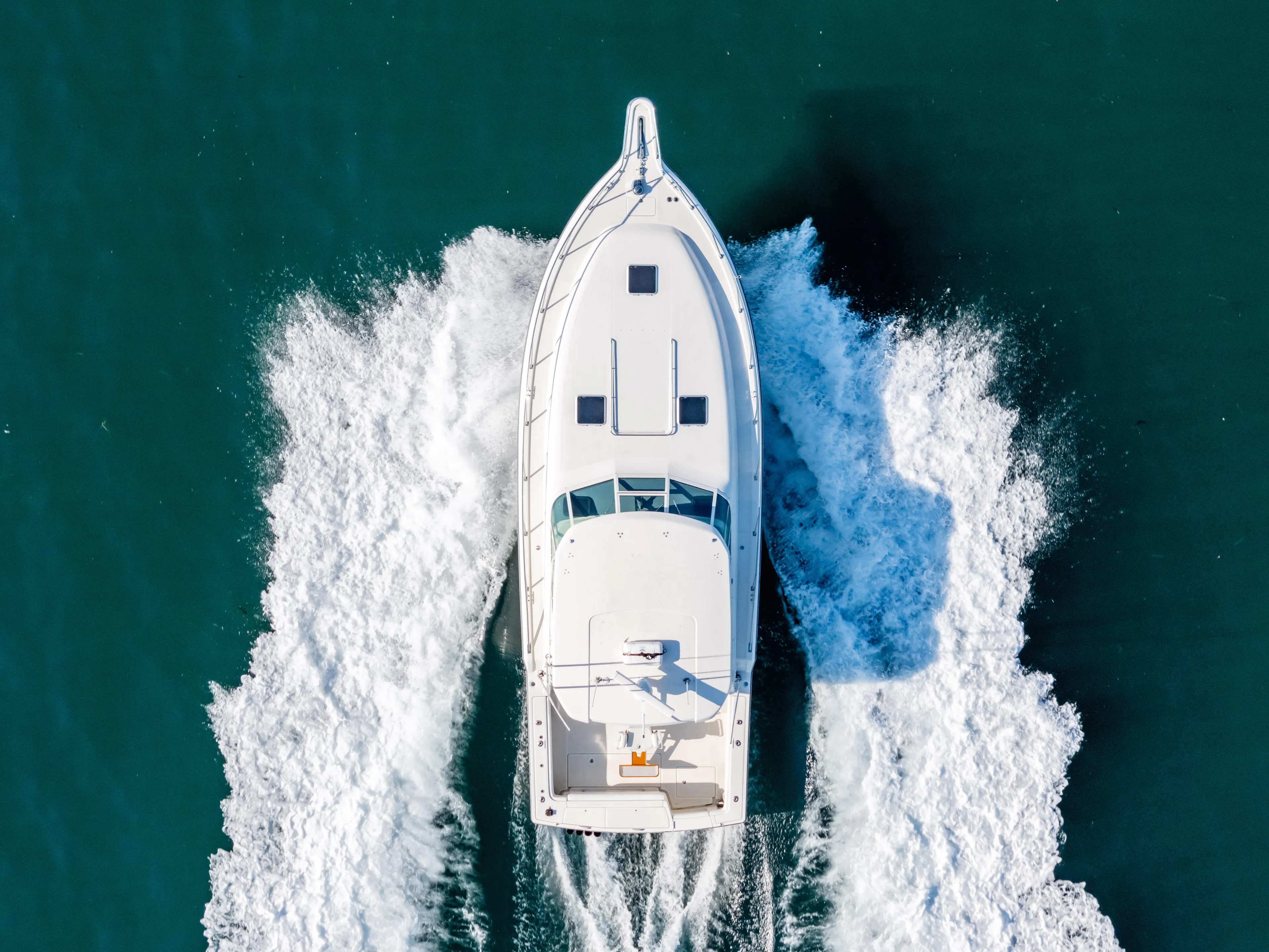 Magic Yacht Photos Pics Aerial view of 1992 Tiara Yachts 4300 Open cruising on water.