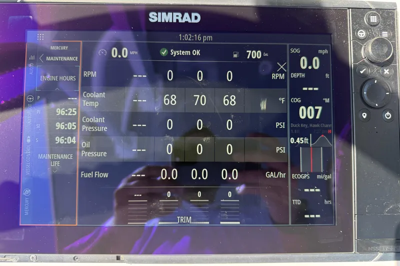  Yacht Photos Pics Simrad display on 2023 Invincible 46 Catamaran showing engine and navigation data.
