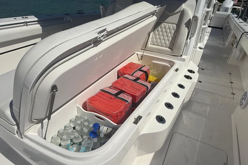 Yacht Photos Pics 2023 Invincible 46 Catamaran storage with life jackets and bottled water.