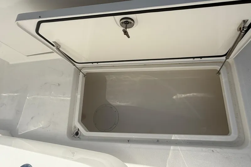  Yacht Photos Pics Open storage compartment on 2023 Invincible 46 Catamaran, showcasing interior space.