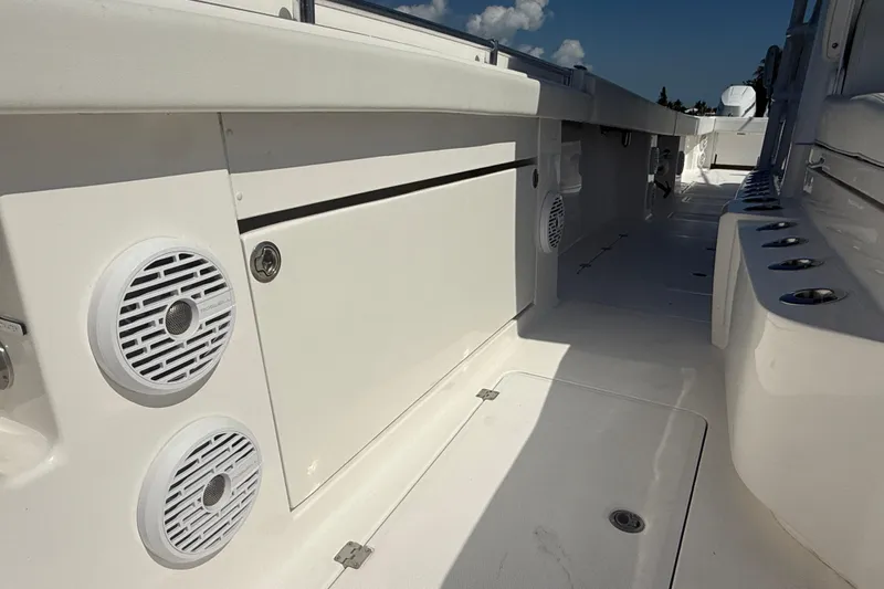  Yacht Photos Pics 2023 Invincible 46 Catamaran deck with speakers and storage compartments.
