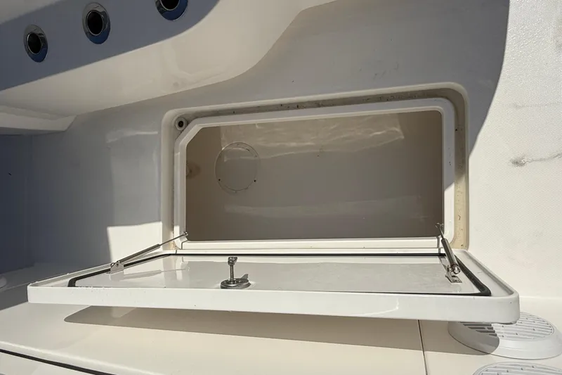  Yacht Photos Pics Open storage compartment on 2023 Invincible 46 Catamaran, showcasing interior space.