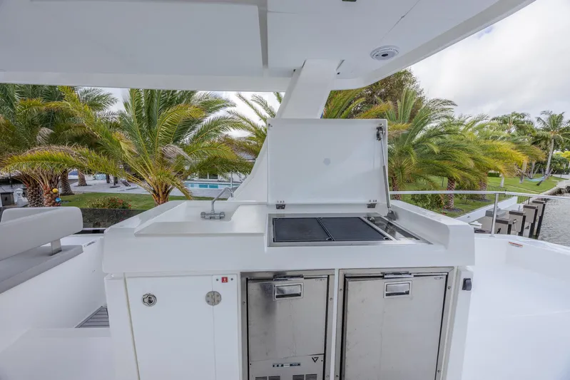  Yacht Photos Pics Outdoor kitchen on 2024 Leopard 53 Powercat yacht with grill and storage.