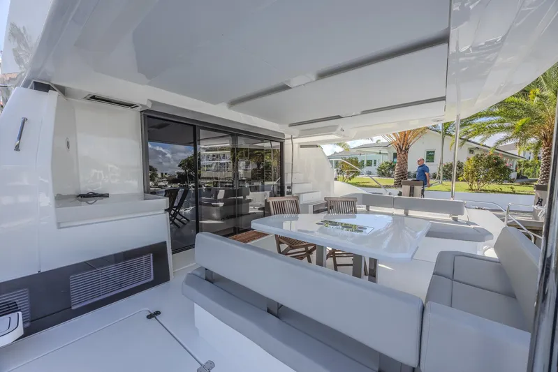  Yacht Photos Pics 2024 Leopard 53 Powercat yacht interior with modern seating and dining area.