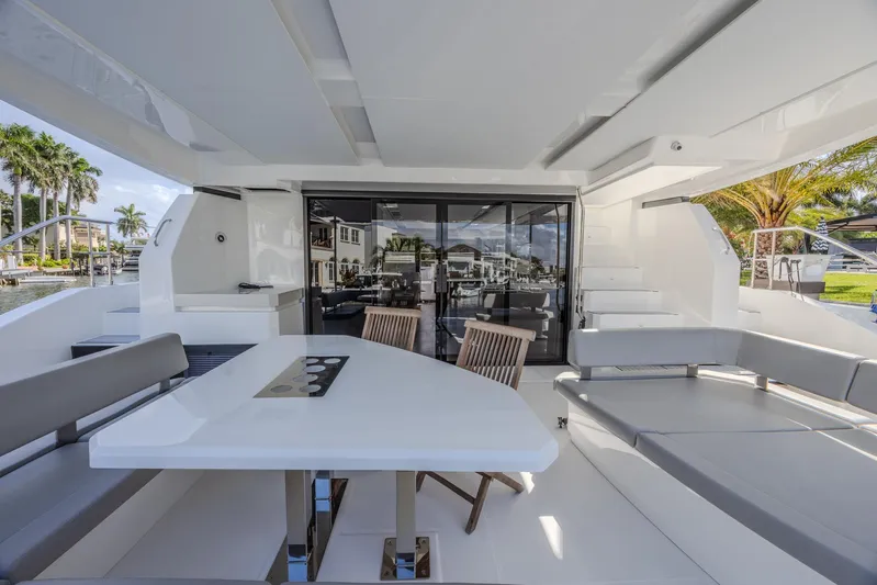  Yacht Photos Pics Luxurious 2024 Leopard 53 Powercat yacht interior with modern seating and dining area.