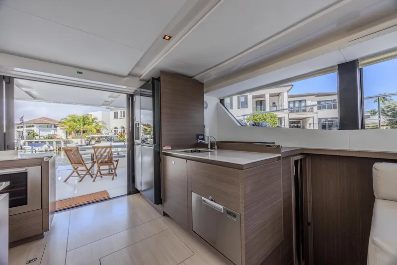  Yacht Photos Pics Interior of 2024 Leopard 53 Powercat yacht with modern kitchen and outdoor seating.