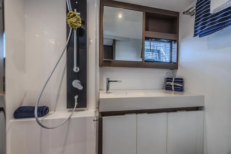  Yacht Photos Pics Luxurious bathroom in 2024 Leopard 53 Powercat yacht with modern fixtures and sleek design.