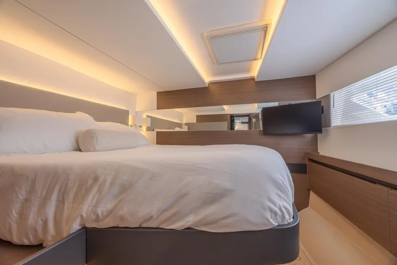  Yacht Photos Pics Luxurious bedroom interior of 2024 Leopard 53 Powercat yacht with modern lighting and sleek design.