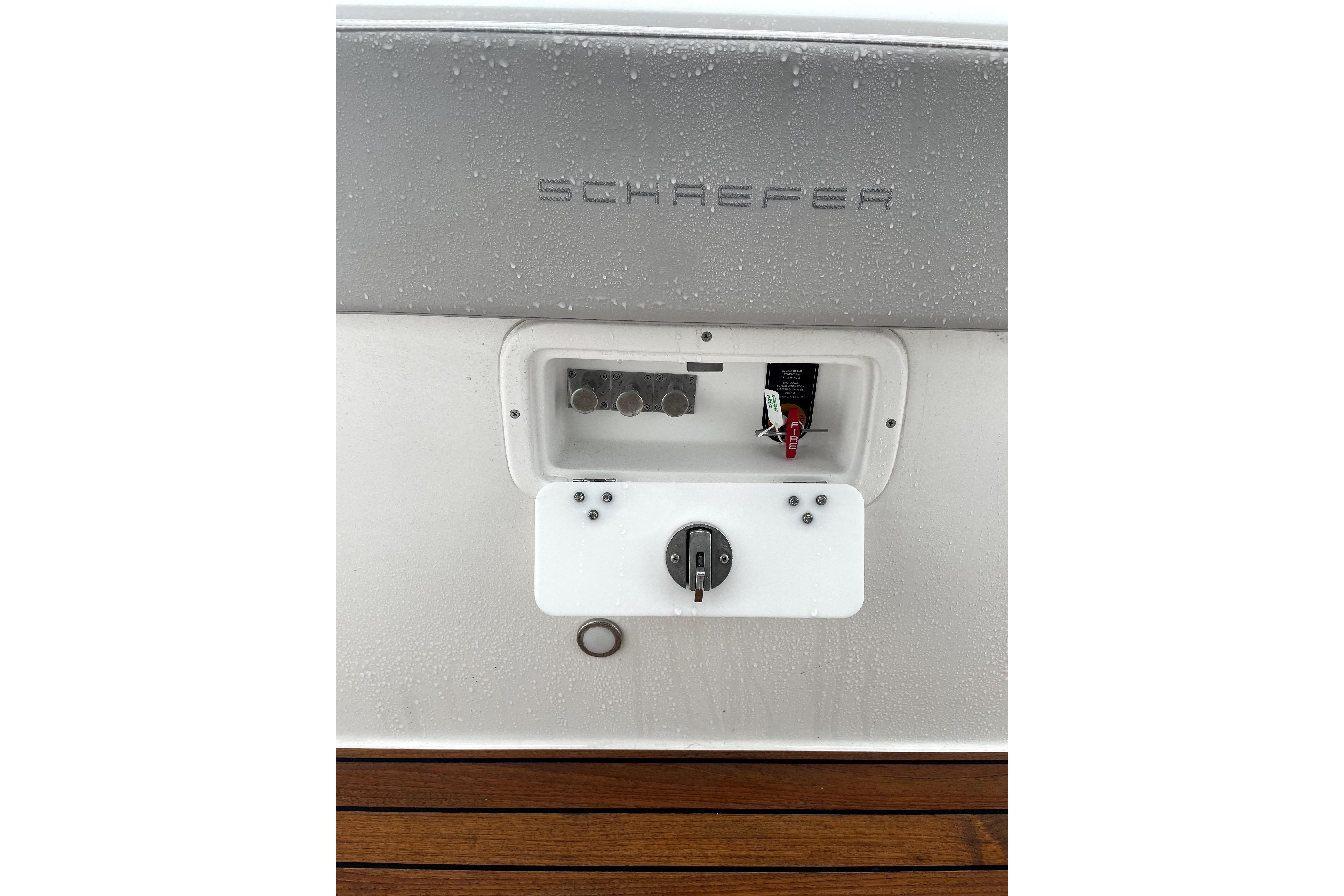 2024 Schaefer V33 boat control panel with switches and dials, featuring sleek design.